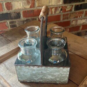 Rustic metal caddy with 4 bottles